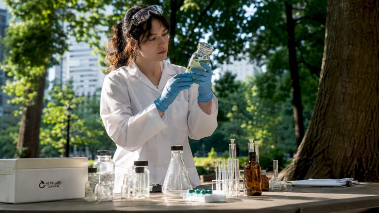 Scientist inspecting US labware in research lab